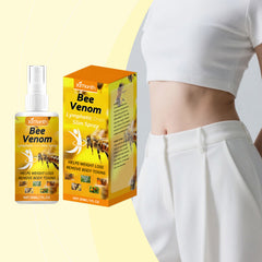 Body spray packaging beside body-care artwork