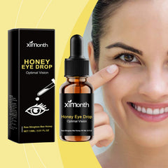 Stingless bee honey eye-drop bottle beside a woman pointing below her eye